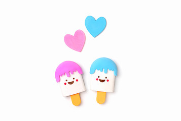 two kawaii ice cream toy and hearts on white background. cute cartoon character, symbol of childhood, summer, vacation. top view, copy space