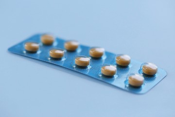 Blue capsule pills closeup