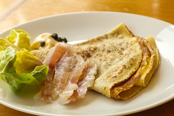 Gravlax with pancake served salad