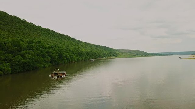 Flying over the river on a sunny summer day. Dniester river of Moldova republic.