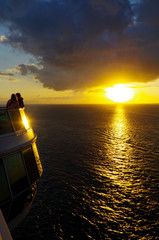 Silhouette of People watching the sunset over the Ocean from Cruise Ship