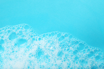 Background soap suds (foam) and bubbles from detergent. House cleaning concept.