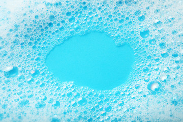 Background soap suds (foam) and bubbles from detergent. House cleaning concept.