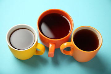 Black tea (coffee) in bright cups, office break, team building.