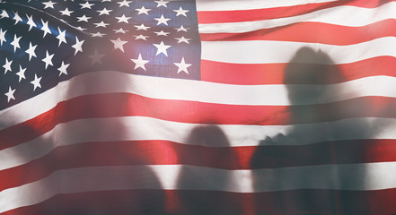 Fototapeta premium People holding the Flag of the USA.