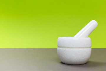 white porcelain New mortar on a gray table