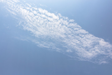 Naklejka na ściany i meble Blue sky with white clouds on sunny sky background