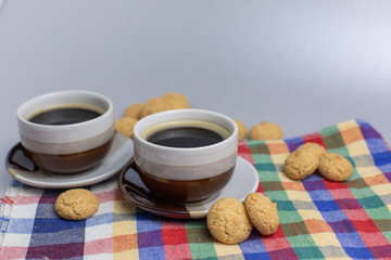 Cookie and two cups of coffee. Kruidnoten, pepernoten, strooigoed