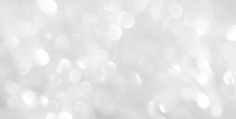 Plakat A brilliant white background with circles and ovals. Template for a holiday card with bright and sparkling lights.