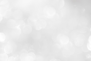 A brilliant white background with circles and ovals. Template for a holiday card with bright and sparkling lights.