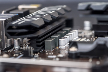 Selective focus on details on motherboard of personal computer