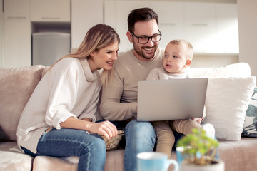 Happy family using laptop