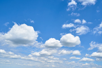 Naklejka na ściany i meble Beautiful blue sky with white clouds, copy space. Blue and white pastel heaven background