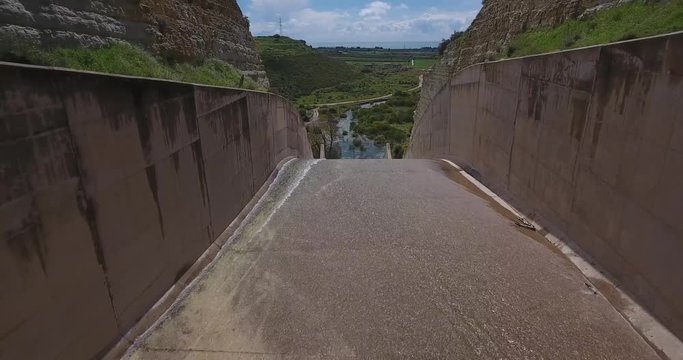 Cinematic Pov Drone Aerial of Water Concrete Chanel System at Dam on Controlled Lake With Waterfall 4k