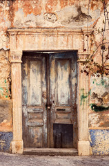 Fototapeta na wymiar The background old beige wall with retro door