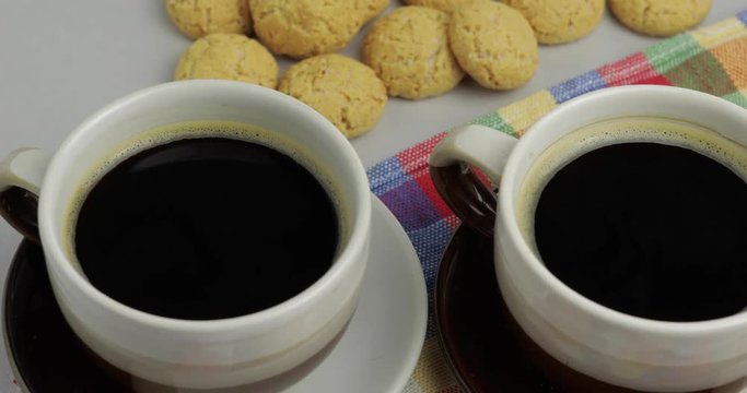 Cookie and two cups of coffee. Kruidnoten, pepernoten, strooigoed