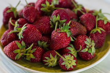 close up strawberries in plate