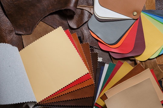 Colorful leather samples in the tailoring workshop. Top view. 