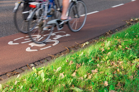 two bikes on a red bicycle path in The Netherlands