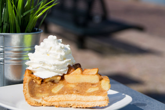 piece of apple pie with whipped cream. 