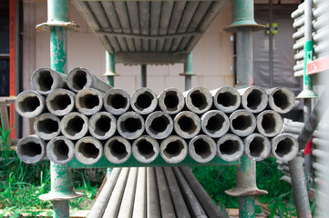 close up metal pipes on shelf, on scaffolding