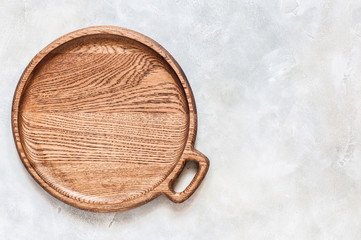 Round Wooden Dish on Grey Background
