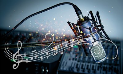 Microphone and  digital studio mixer  on background