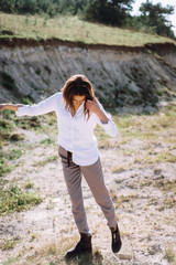 Beautiful and happy woman girl have fun and relax in summer. Portrait of a beautiful girl on the Planer near the cliff. Freedom for a walk