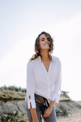 Beautiful and happy woman girl have fun and relax in summer. Portrait of a beautiful girl on the Planer near the cliff. Freedom for a walk