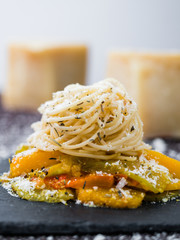 Spaghetti Pasta with vegetables, cheese and herbs.