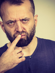 Confused focused serious man thinking