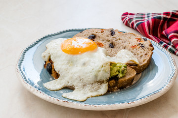 Fried Egg with Avocado on Toast Bread for Breakfast