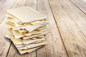 File folders with documents on white background