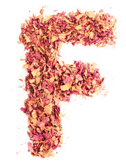 Letter F, made of rose petals, isolated on white background. Food typography, english alphabet. Design element.