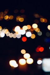 colorful bokeh lights in the street in the city at night