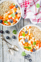 Breakfast oatmeal with tropical fruits
