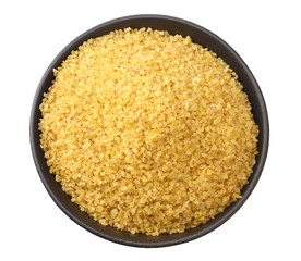dry bulgur wheat in bowl isolated on white background. top view