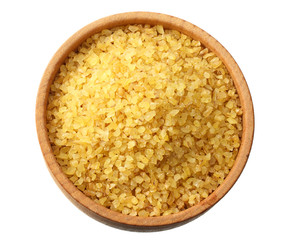 dry bulgur wheat in bowl isolated on white background. top view