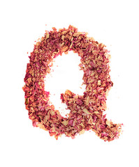 Letter Q made of rose petals, isolated on white background. Food typography, english alphabet. Design element.