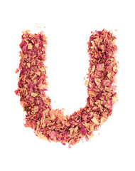 Letter U made of rose petals, isolated on white background. Food typography, english alphabet. Design element.