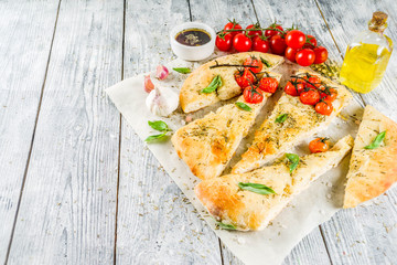 Focaccia with tomatoes and basil