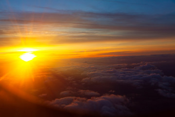 flight in the evening over the clouds