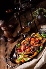 tender beef topped with various vegetables