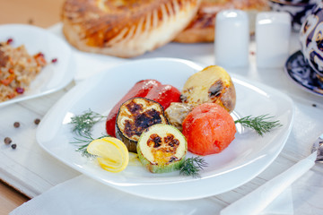 White plate with grilled vegetables.