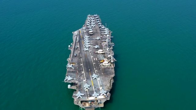 Aerial view America battleship navy nuclear aircraft carrier, USA military navy ship airplane carrier full loading plane fighter jet aircraft, United States of America, USA, 4K.