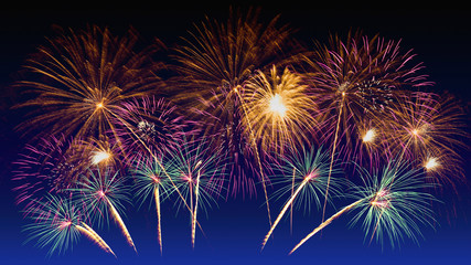 Fototapeta na wymiar Colorful fireworks celebration and the twilight sky background.