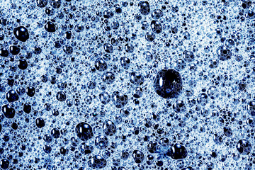 Water foam texture. Blue bubble spa washing background.