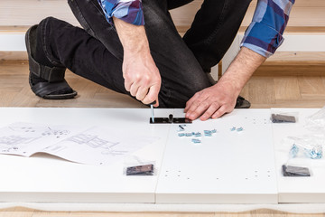 The buyer collects ready-to-assemble folding table. Ready-to-assemble furniture. Installation of...