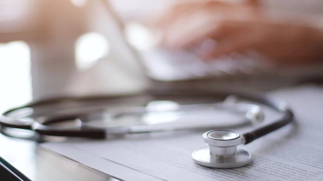 medical doctor online, stethoscope and hands typing on computer, therapist physician working on diagnosis