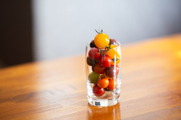 Colorful tomatoes in a glass